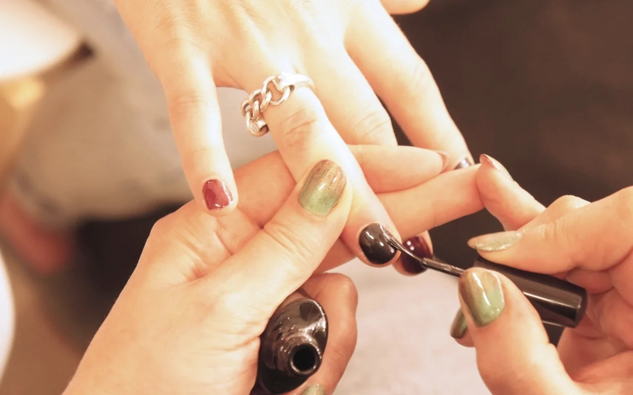 Stock photo of nail polish being applied during a manicure